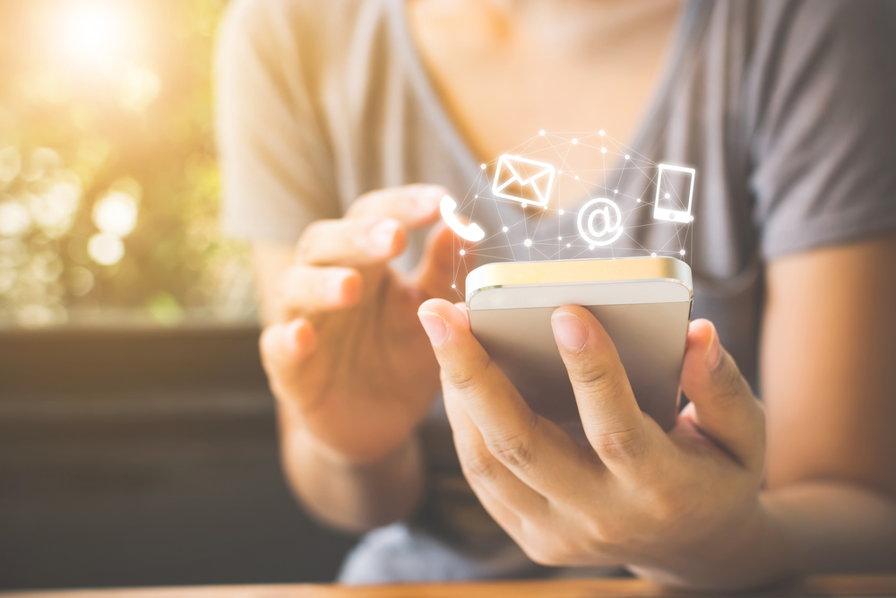 woman,hand,using,smart,phone,,contact,us,connection,concept