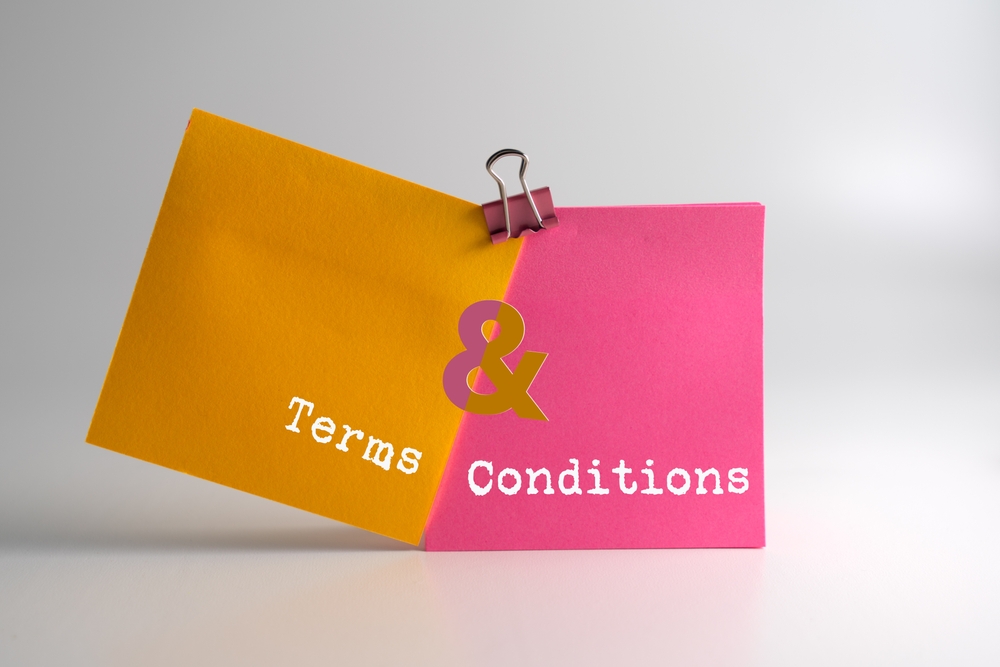 two,sticky,notes,stick,together,with,text,terms,and,conditions